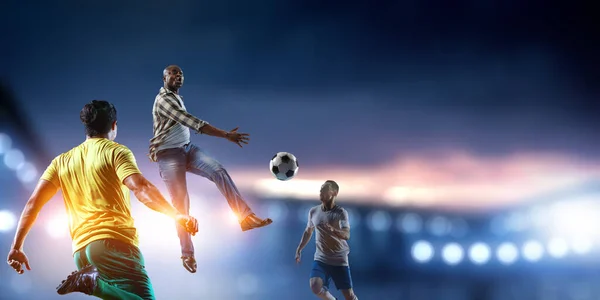 Soccer man in action with ball. Mixed media — Stock Photo, Image