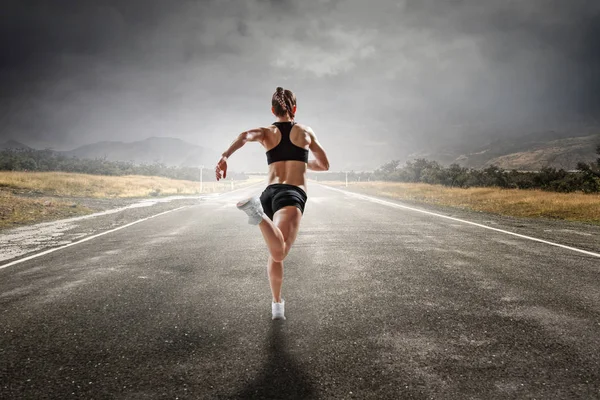 Sportswoman run race. Mixed media — Stock Photo, Image