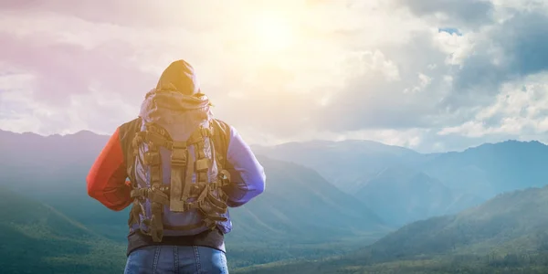 Hiker man in mountains. Mixed media — Stock Photo, Image