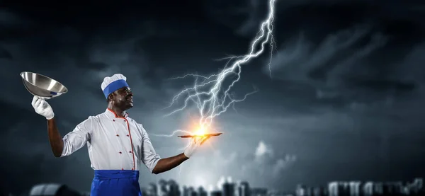 Cook preparing something special. Mixed media — Stock Photo, Image