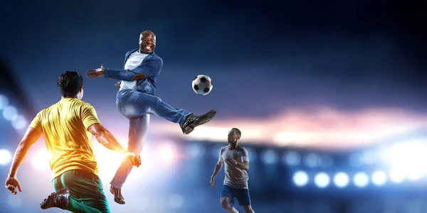 Soccer man in action with ball. Mixed media — Stock Photo, Image