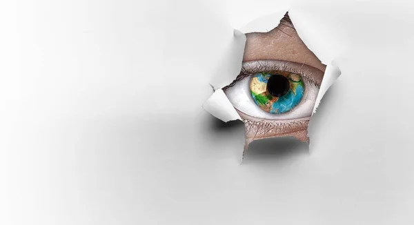 Eye peeping through hole. Mixed media — Stock Photo, Image