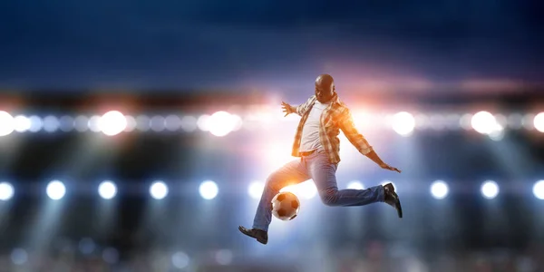 Voetbal man in actie met bal. Mixed media — Stockfoto