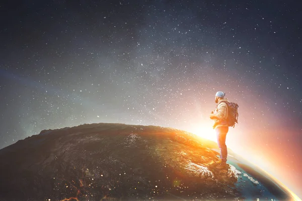 Hiker man on globe. Mixed media — Stock Photo, Image