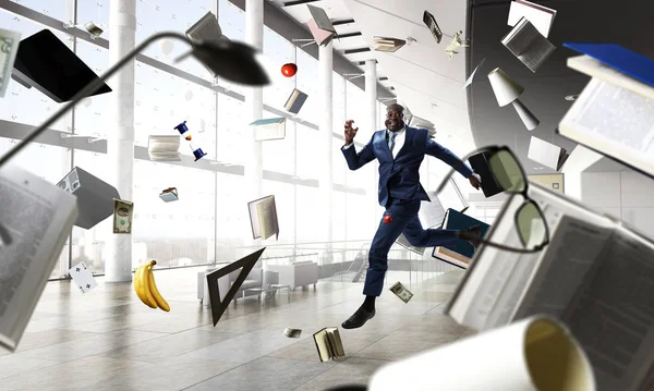 Cheerful businessman jumping high. Mixed media — Stock Photo, Image