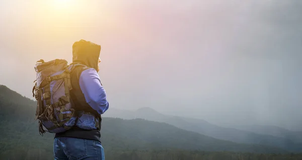 Hiker man in mountains. Mixed media — Stock Photo, Image