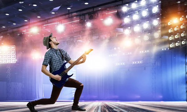 Guitarist at concert. Mixed media — Stock Photo, Image