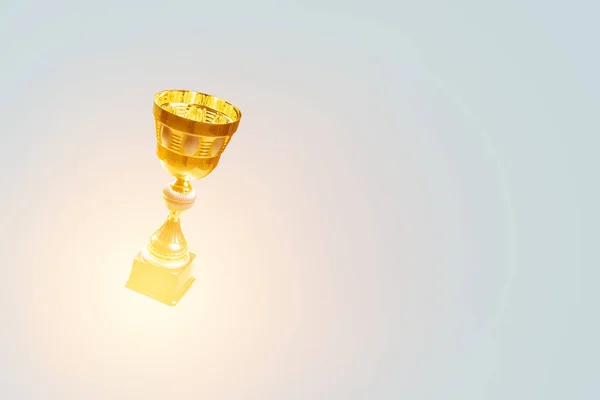 Golden cup on blue . Mixed media — Stock Photo, Image