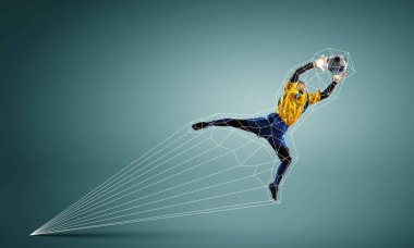 Futbol kalecisi topu yakalar. Karışık ortam