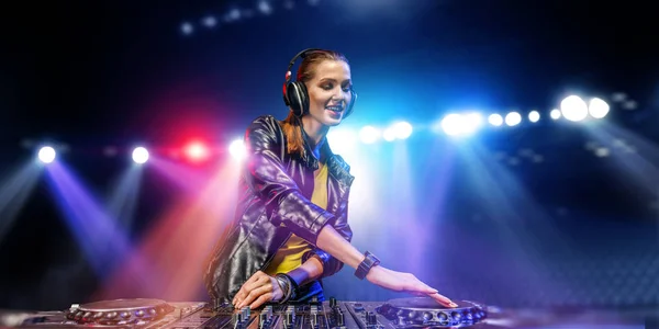 Female dj in nightclub. Mixed media — Stock Photo, Image
