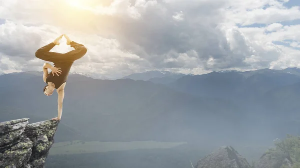 Extreme yoga practice. Mixed media — Stock Photo, Image