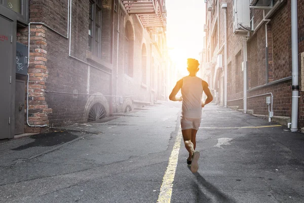 Atleet man lopende race. Mixed media — Stockfoto