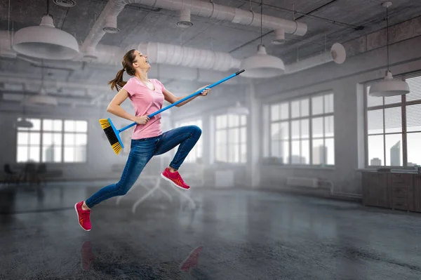 Woman doing funny cleaning. Mixed media — Stock Photo, Image