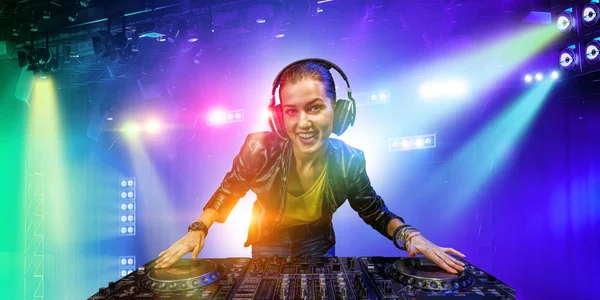 Female dj in nightclub. Mixed media — Stock Photo, Image