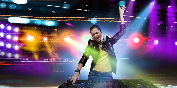 Female dj in nightclub. Mixed media — Stock Photo, Image
