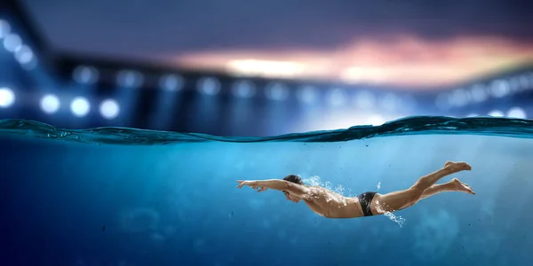 Swimmer at competition. Mixed media — Stock Photo, Image