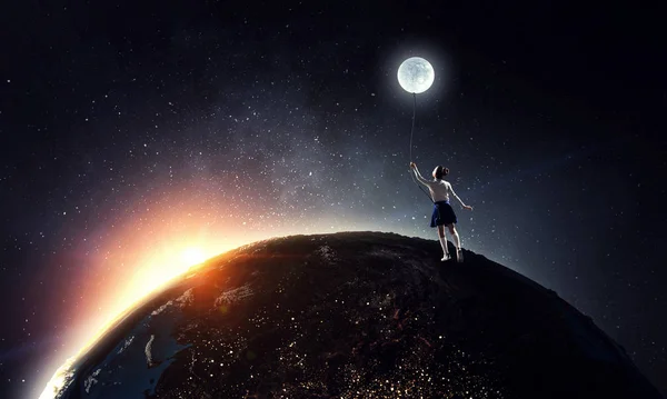 Kid girl catching moon. Mixed media — Stock Photo, Image