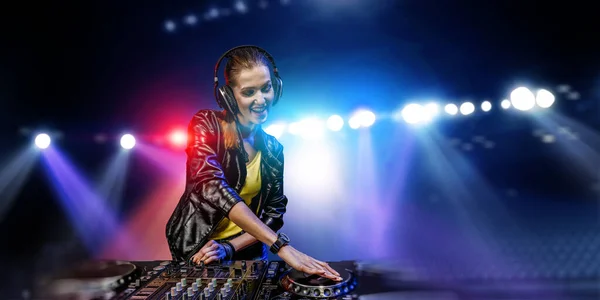 Female dj in nightclub. Mixed media — Stock Photo, Image