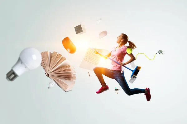 Woman doing funny cleaning. Mixed media — Stock Photo, Image