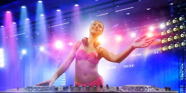 Cute dj woman at console. Mixed media — Stock Photo, Image