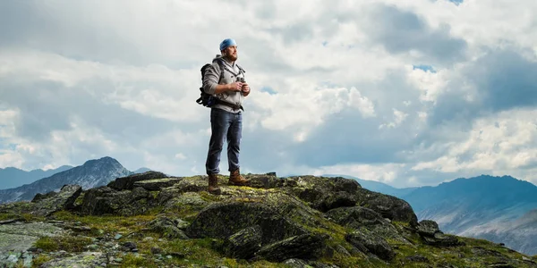 Hiker man in mountains. Mixed media — Stock Photo, Image