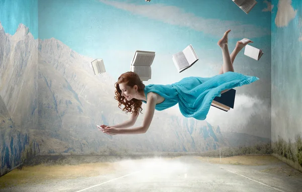 When reading takes you away. Mixed media — Stock Photo, Image
