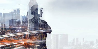 Builder man against cityscape . Mixed media