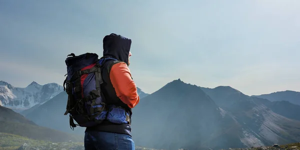 Hiker man in mountains. Mixed media — Stock Photo, Image