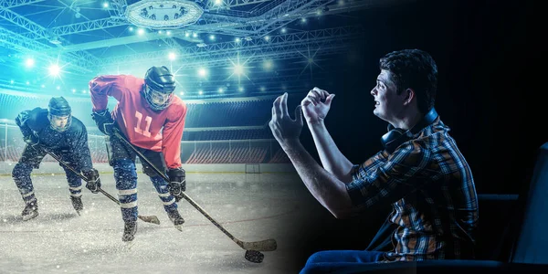 Ung man tittar på ishockeyspel på TV — Stockfoto