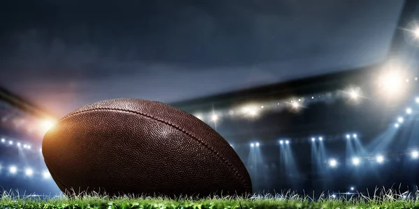 Night football arena in lights with a ball close up — Stock Photo, Image