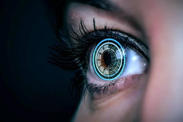 Close up of woman eye in process of scanning — Stock Photo, Image