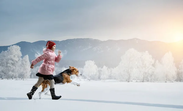 Girl walking with a dog in winter — Stock Photo, Image