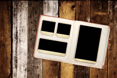Retro photo album with vintage photo on old wooden boards clipart