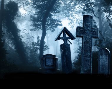 Medieval stone crosses and tombstones, cemetery in misty forest clipart