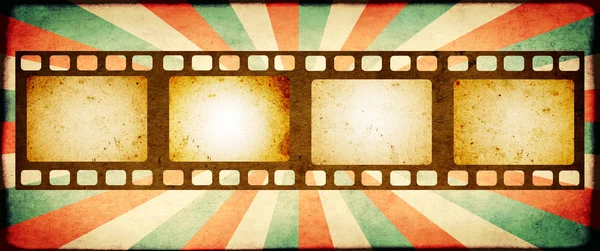 Grunge background with retro filmstrips and paper texture — Stock Photo, Image