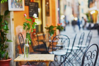 Cozy outdoor cafe in Rome, Italy clipart