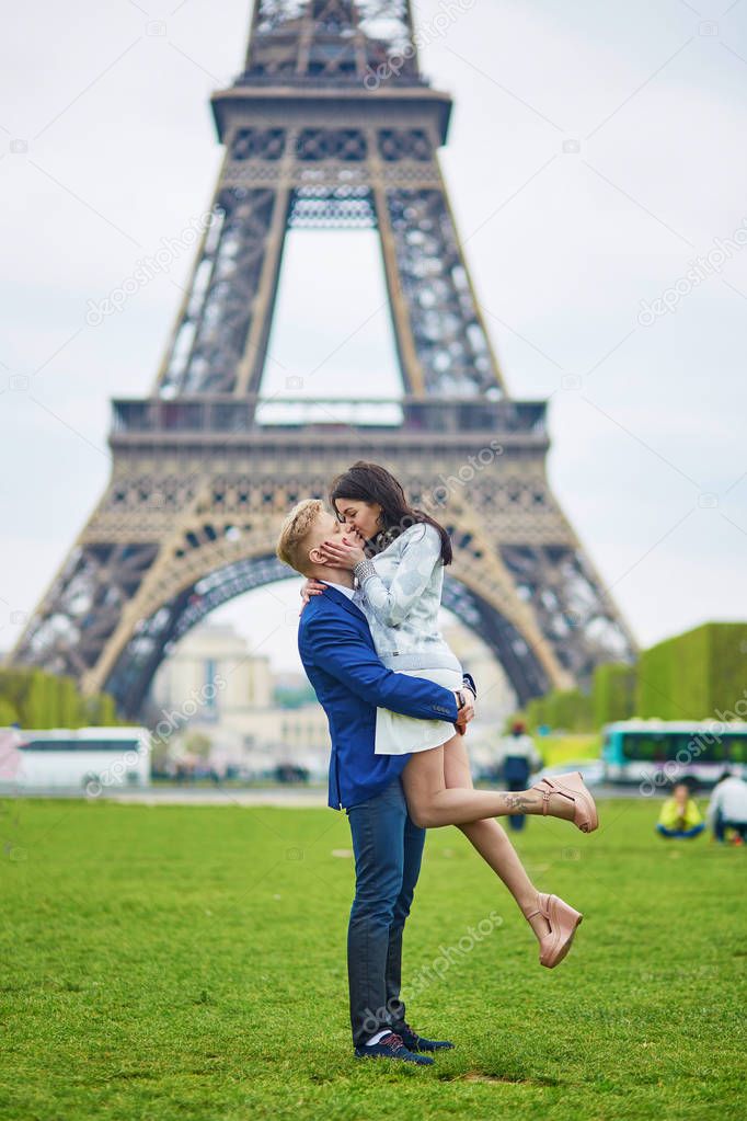 Romantic couple in Paris near the Eiffel tower