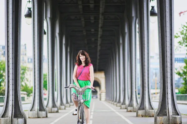 Woman riding a bicycle on a street of Paris — Stock Photo, Image