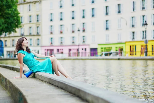 Cheerful young French woman having fun on Saint-Martin canal — Stock Photo, Image