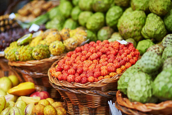 Fresh and ripe exotic fruits on traditional farmer market on Madeira