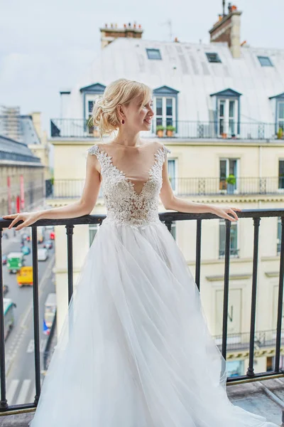 Beautiful young bride on the balcony of her home or hotel room — Stock Photo, Image