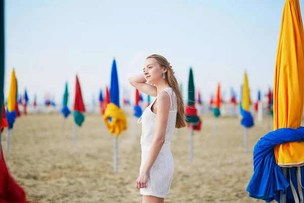 Woman with famous colorful parasols on Deauville Beach in France — Stock Photo, Image