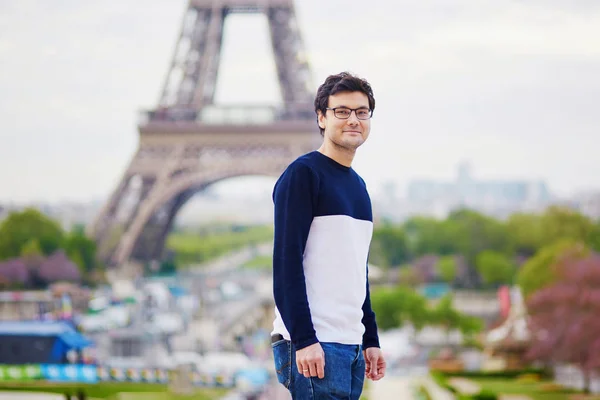Man in Paris in front of the Eiffel tower
