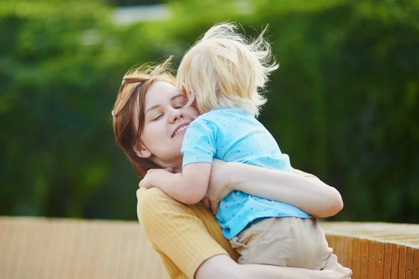 Mother hugging her little toddler boy Stock Image