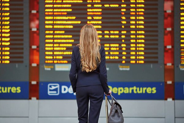 Young elegant business woman in international airport