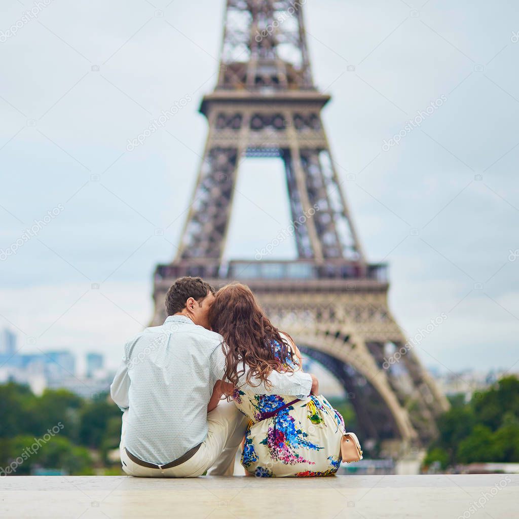 Happy couple near the Eiffel tower