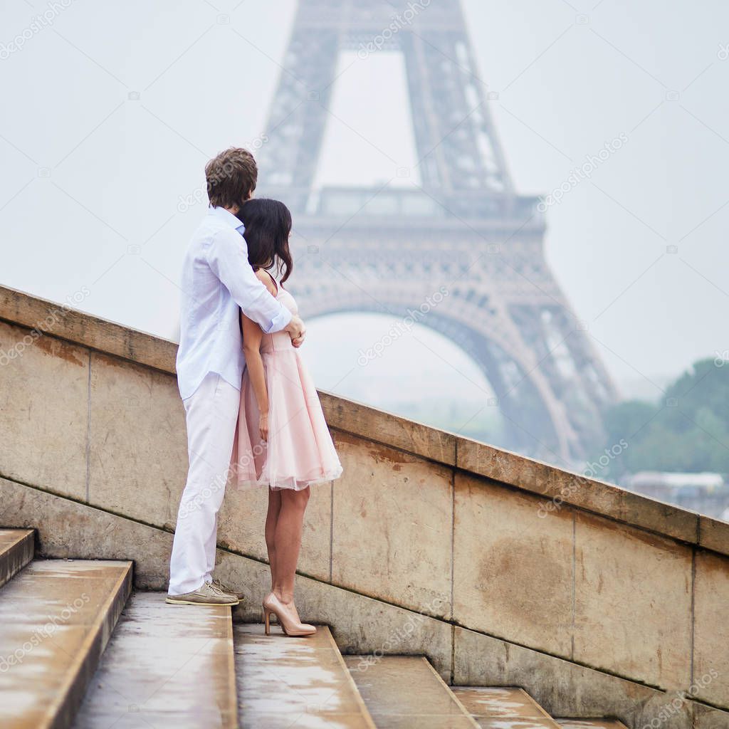 Happy couple near the Eiffel tower