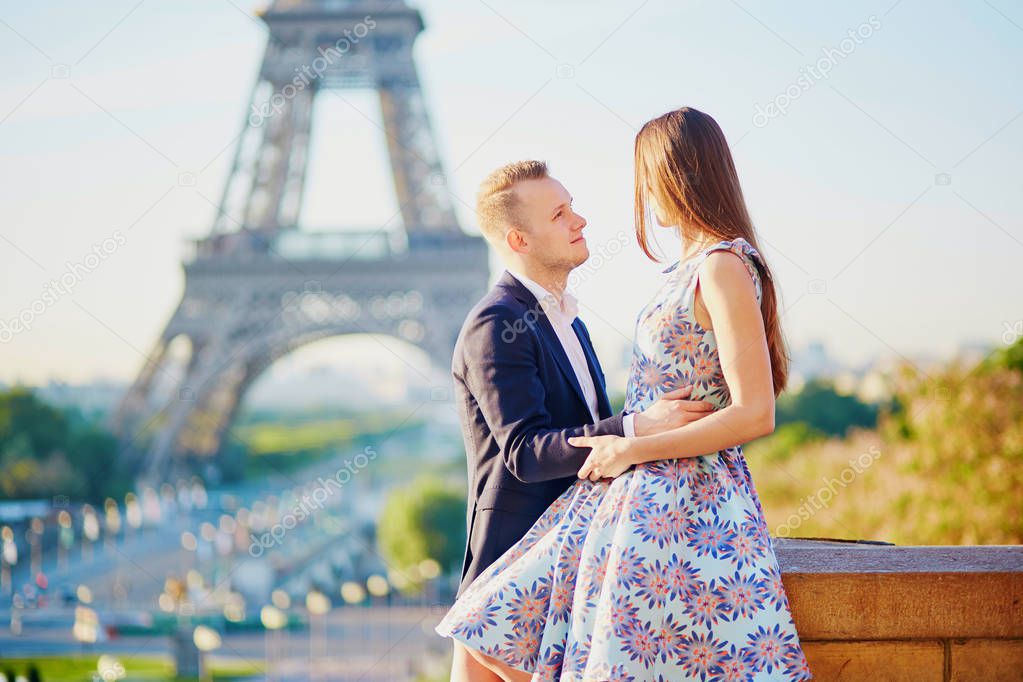 Romantic couple near the Eiffel tower in Paris, France