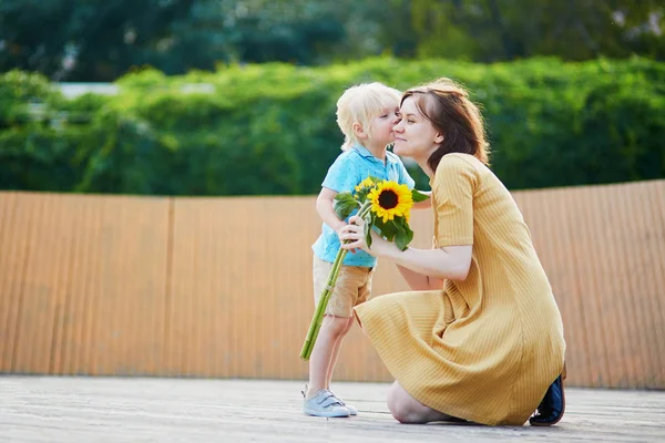 Adorable Little Boy Offering Bunch Sunflowers His Mom Child Making — Stock Photo, Image