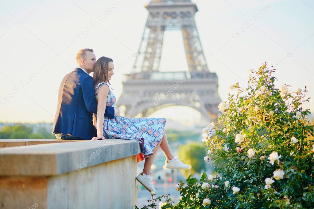 Romantic couple near the Eiffel tower in Paris, France